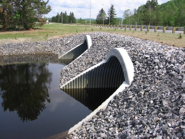 Bolt-A-Plate​ structural steel plate culverts with step bevel end treatments