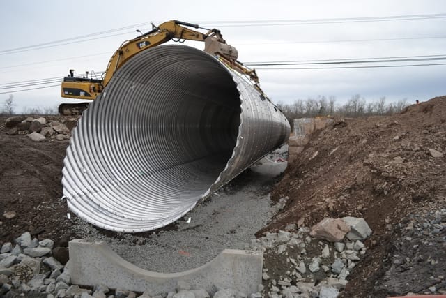 Structural Plate Corrugated Steel Pipe​ lowers into place