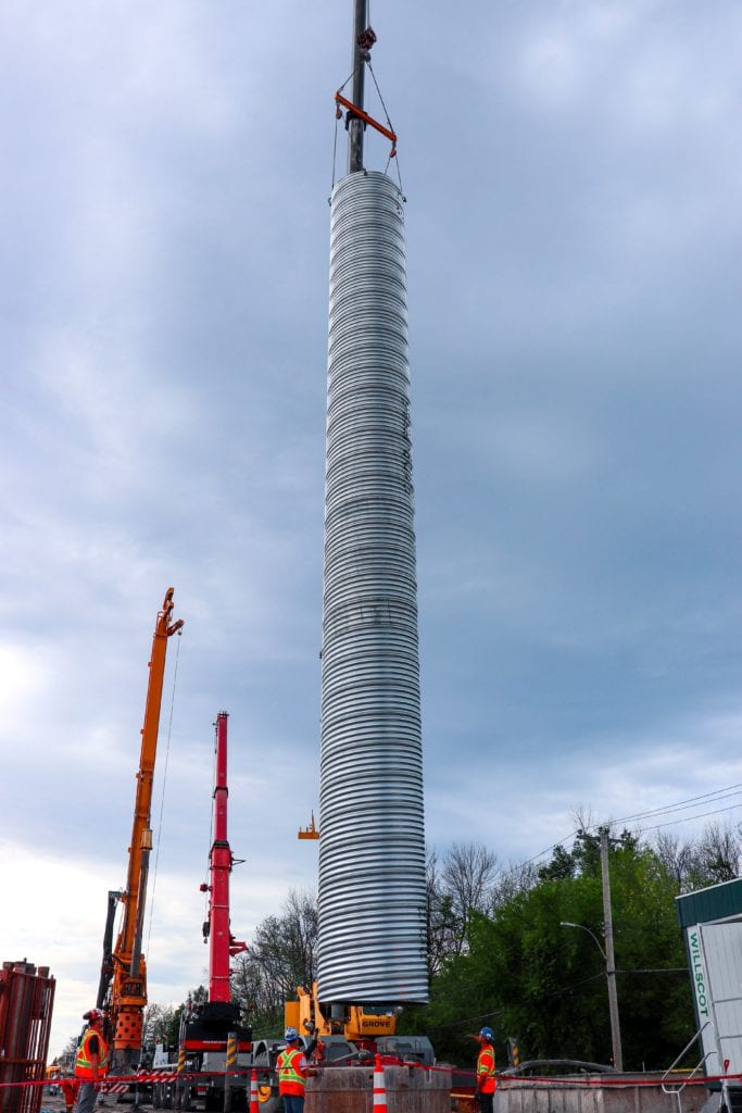 Crane lowering Corrugated Steel Pipe caisson